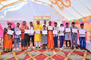 JYLD Ideal Inter College varshikotsav 2026 mein annual function mein participate karne wale vidyarthiyon ko participation certificate diya gaya manch par